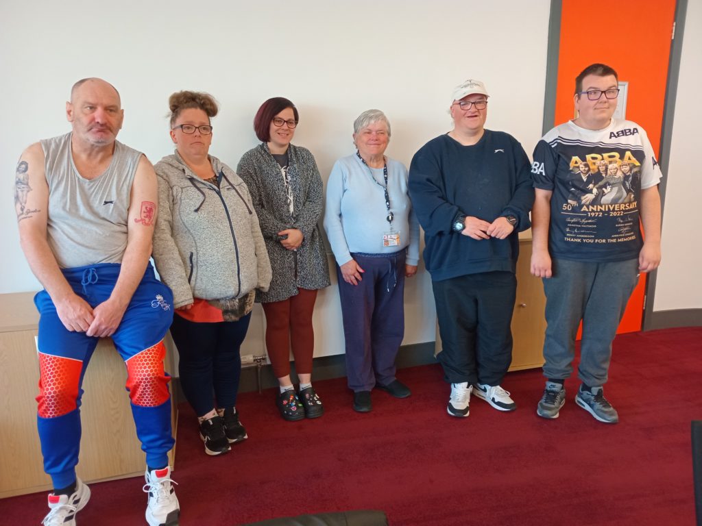 a group of people standing in a room